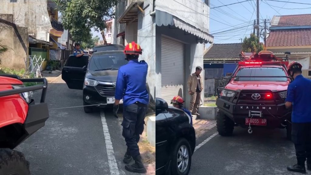 Damkar Kota Malang Lakukan Evakuasi Mobil Terperosok di Sawojajar (Instagram/@malangfire)