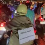 Ibu Hamil Tulis Pesan Menyentuh di Punggung Saat Naik Motor, Viral di Media Sosial (TikTok @rizki.pertama42)
